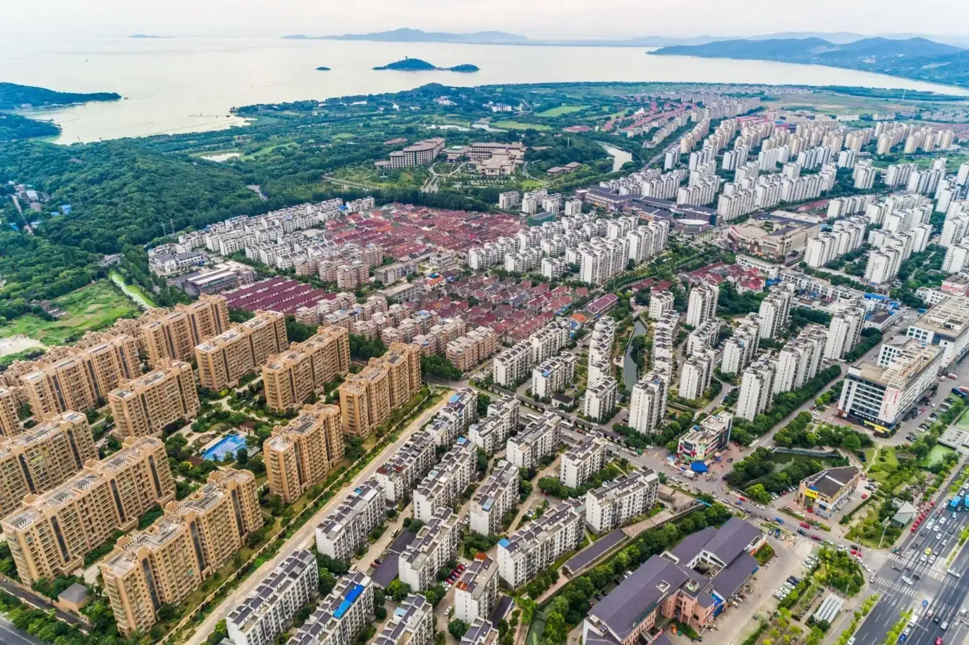 Aerial view of a large city spreading toward the water