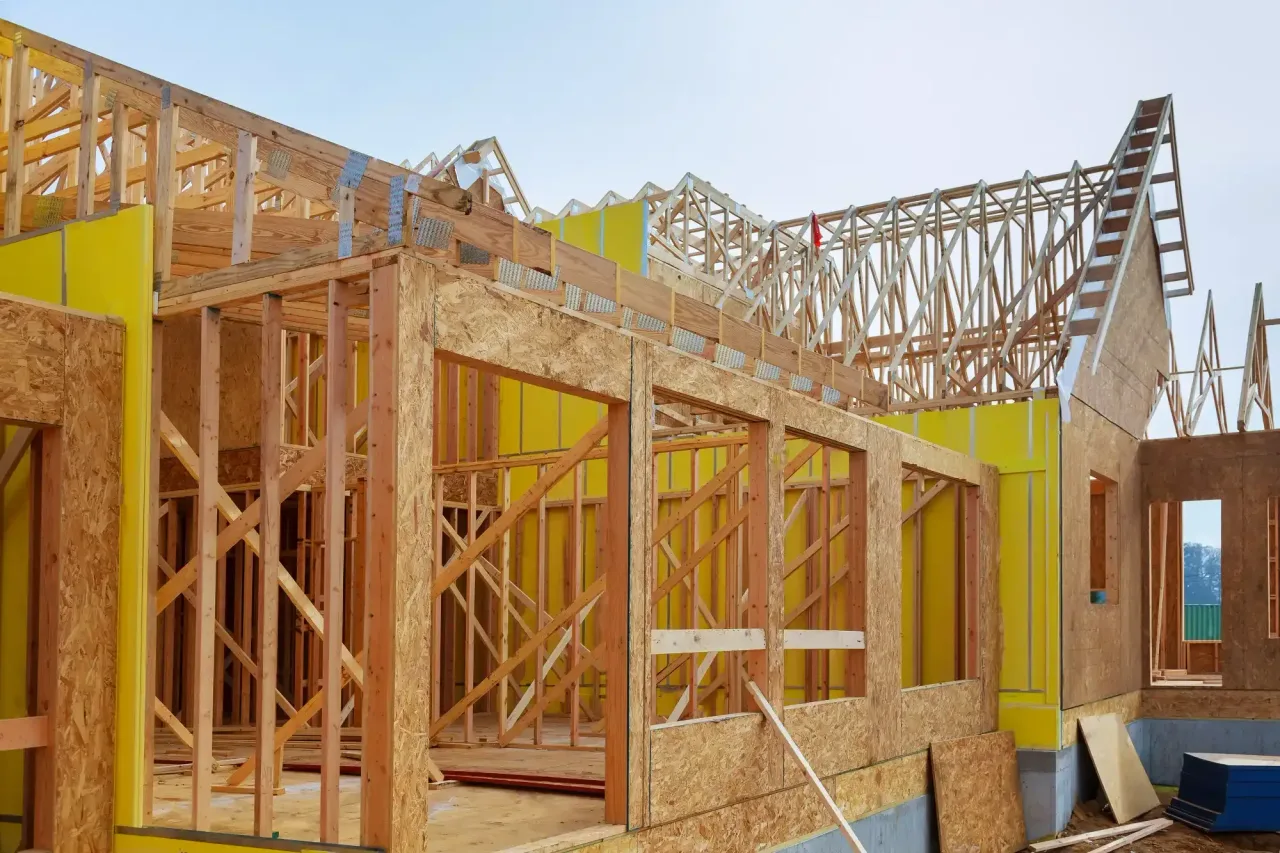 Timber framing and roof trusses on a home under construction