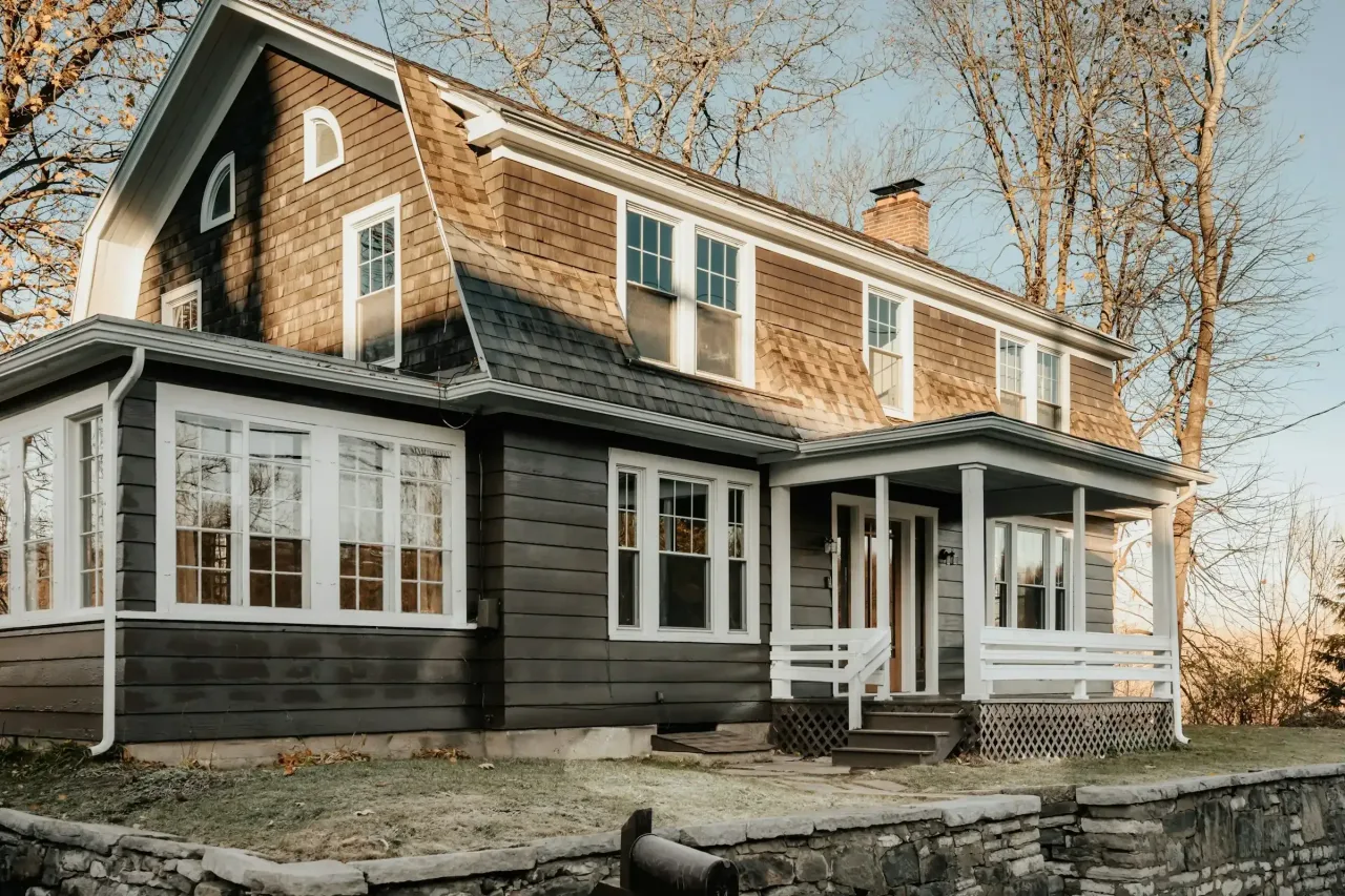 Two-story shingled house with a covered porch