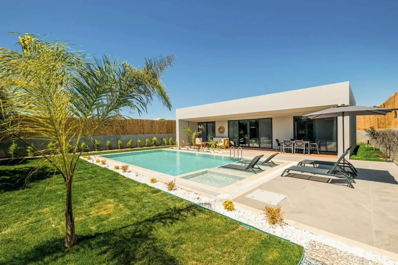 Modern single-story home with a backyard pool