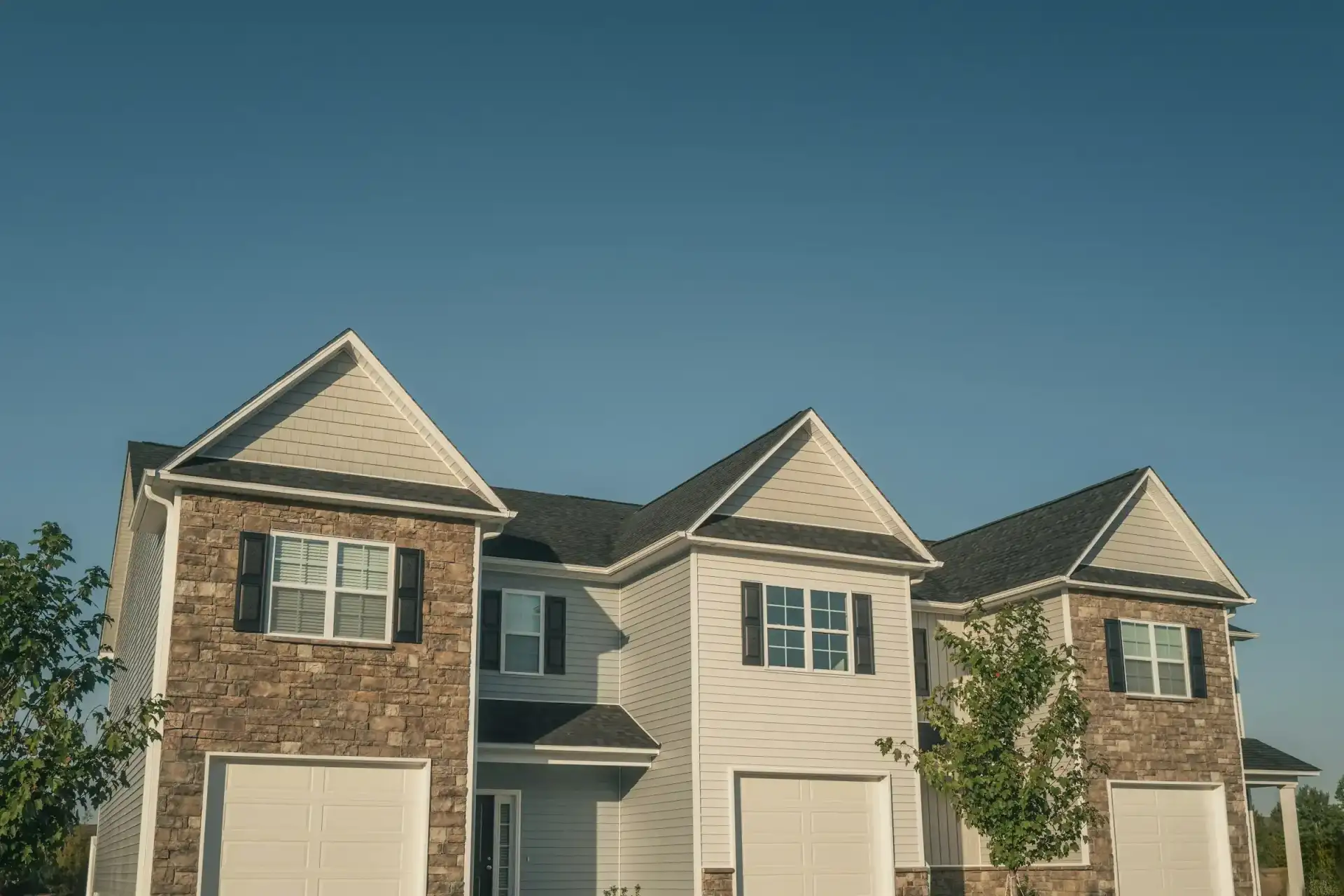 New stone and siding townhomes with garages
